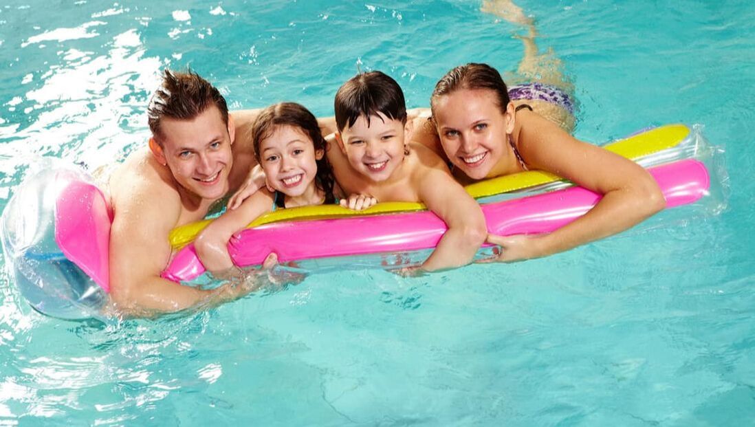 Photo of a happy family in their swimming pool in Dubai